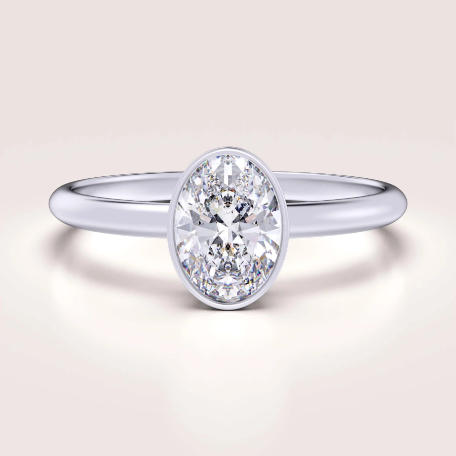 pierscionek-zareczynowy-bezel-moissanit-0-5ct-szlif-owalny-biale-zloto-pure-hariets.jpg