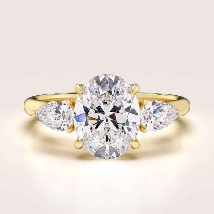 pierscionek-zareczynowy-trinity-seraphina-moissanit-2ct-centralny-szlif-owalny-zolte-zloto-hariets.jpg